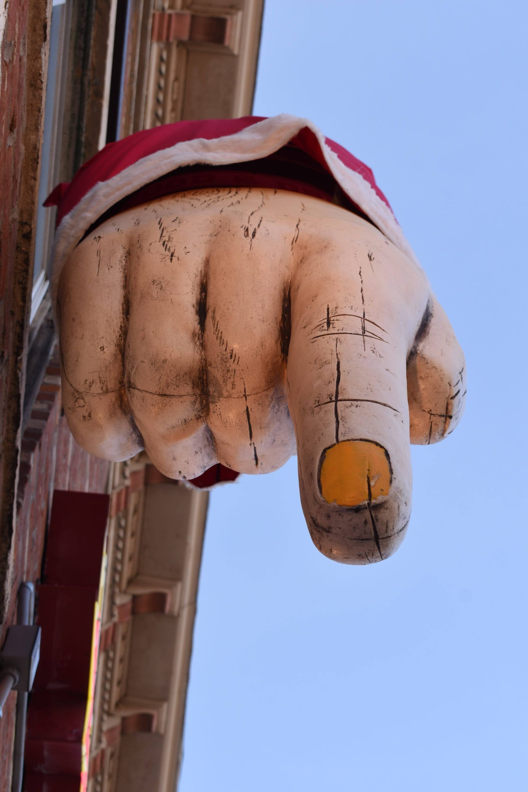 a large finger pointing downward